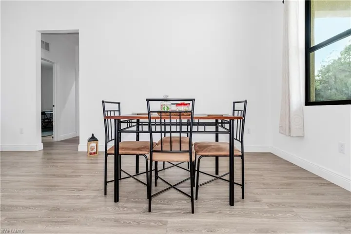 Dining space featuring light wood finished floors and baseboards