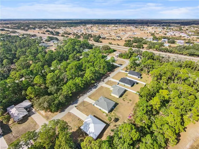 Aerial overview of property's location featuring nearby suburban area