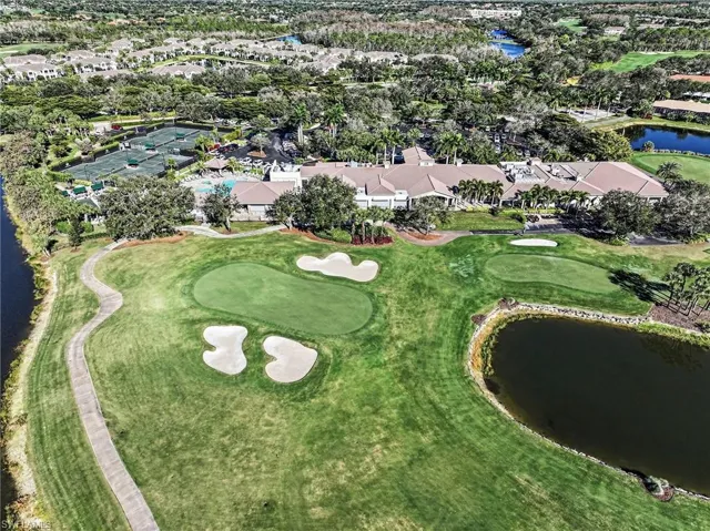 Aerial view of property and surrounding golf course