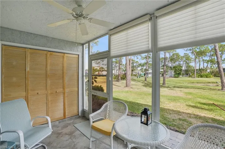 Sunroom with a ceiling fan