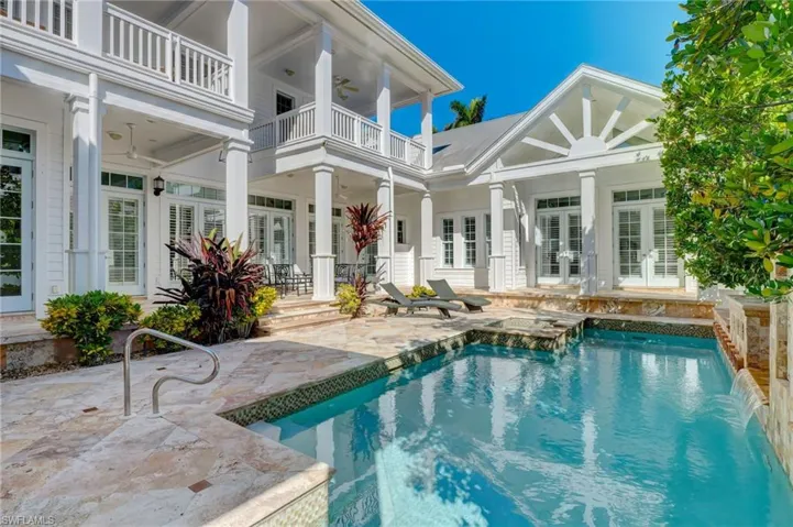 View of swimming pool featuring a hot tub, ceiling fan, french doors, and a patio area