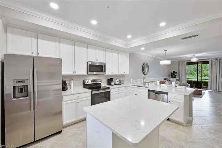 WHITE, BRIGHT AND OPEN KITCHEN FOR EASY ENTERTAINING WITH WATER VIEW