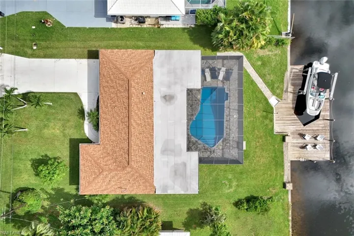 Bird's eye view of a pool and a large body of water