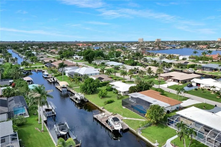 Aerial view of residential area with a large body of water