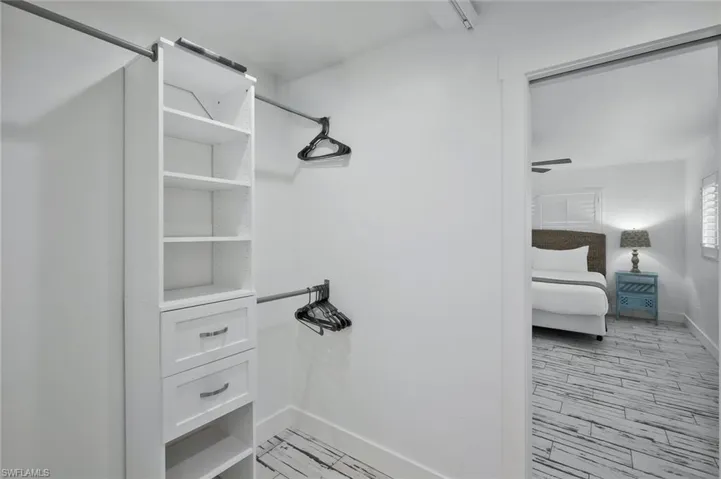 Spacious closet featuring light wood-type flooring