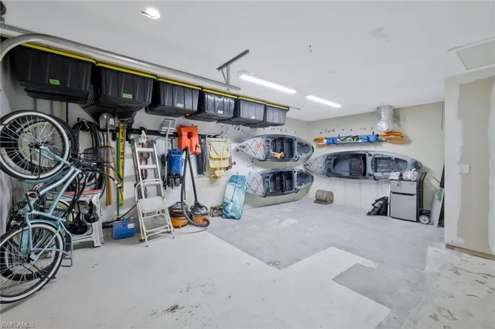 Garage featuring refrigerator