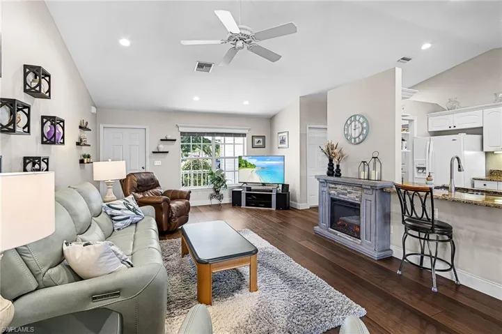 Enjoy the wonderful OPEN split floor plan, vaulted ceilings, uxury woodgrain plank vinyl floor in living areas, laundry room and bathrooms for easy upkeep.