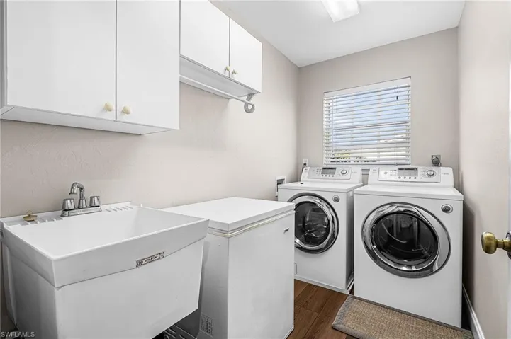 Comes with newer front load washer and dryer, laundry sink and cabinets.