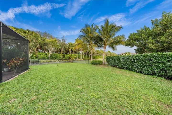 Oversized lot - yard extends around cage & is fully fenced