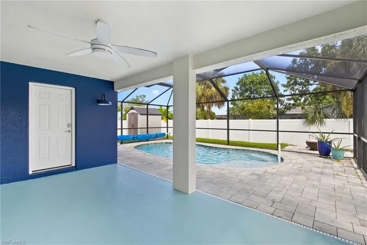 View of Swimming Pool and Patio Area, with a Covered Lanai, Guest/Pool Bath Entry