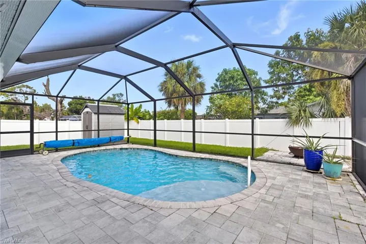 View of Screened in Swimming Pool Paver  Area