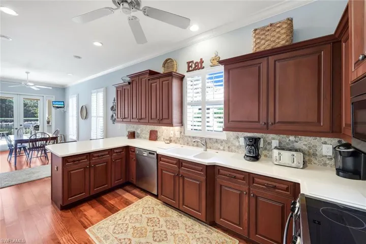 Dining room featuring light wood-style floors and ornamental molding