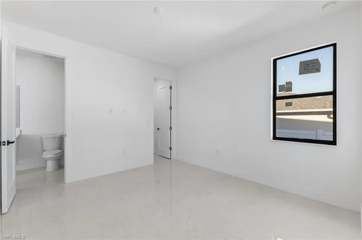 Unfurnished bedroom with baseboards