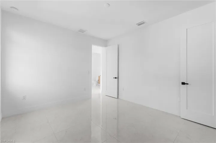 Unfurnished bedroom with baseboards