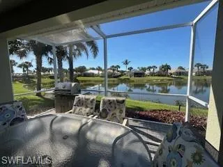 View of patio / terrace featuring a water view and a lanai