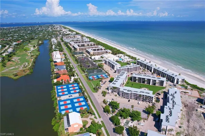 Bird's eye view featuring a view of the beach and a water view