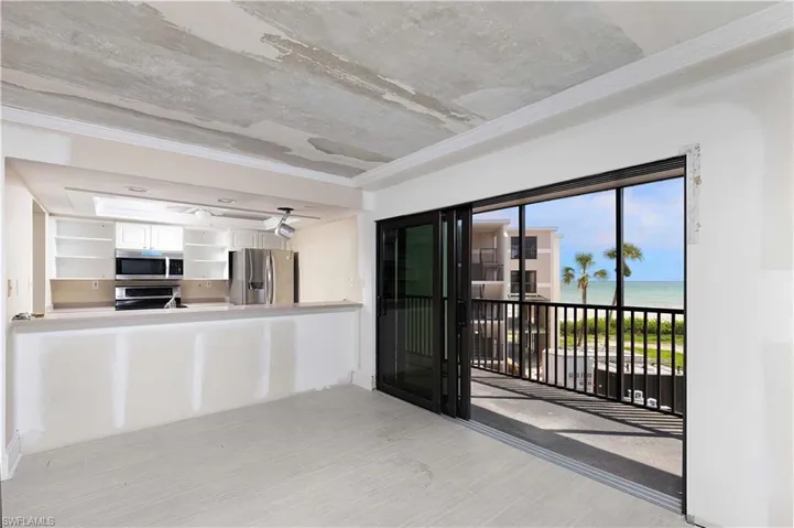 Kitchen featuring a water view, white cabinetry, and appliances with stainless steel finishes