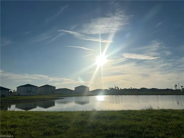 Water view with nearby suburban area