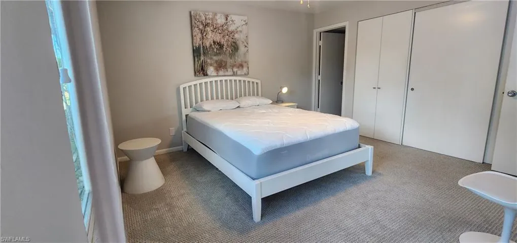 Bedroom featuring a closet and carpet floors