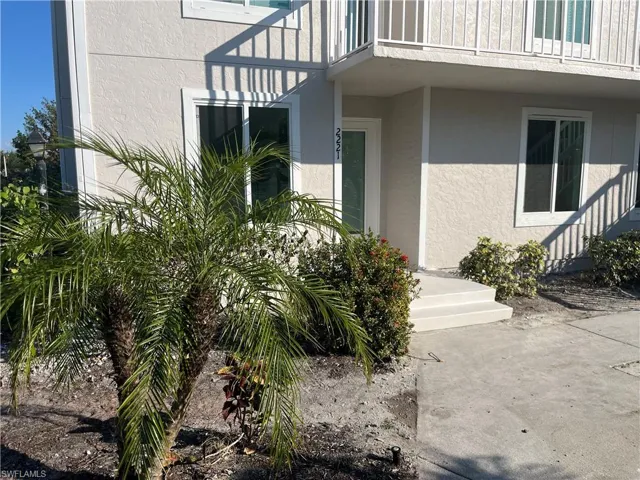 Property entrance with stucco siding