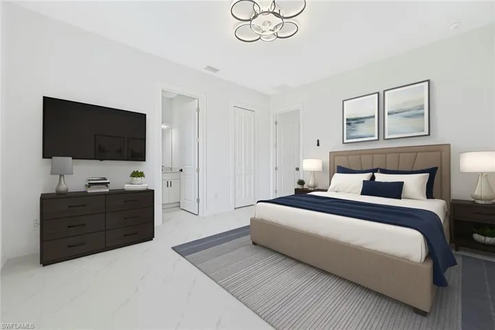 Bedroom featuring light marble finish floors, a chandelier, ensuite bathroom, and a closet