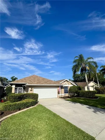 Front of home with concrete curbing