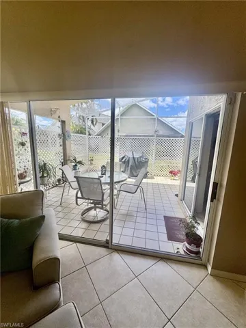 Triple sliders to screened lanai from great room