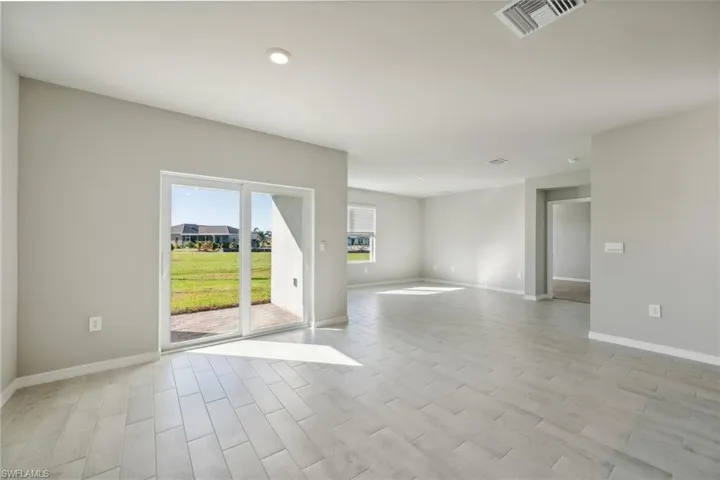 Unfurnished room featuring wood tiled floors and recessed lighting