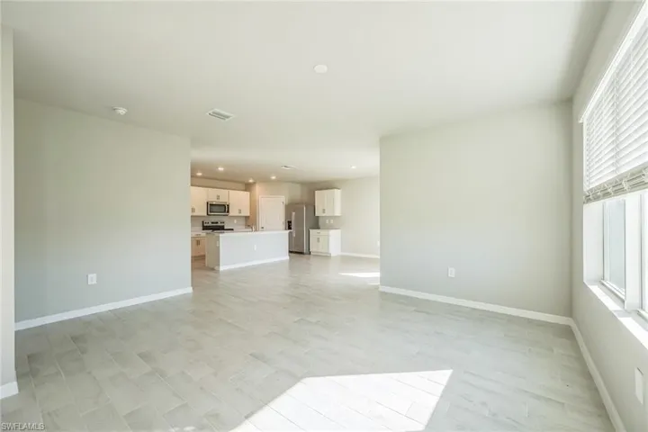 Unfurnished living room with recessed lighting and light wood-style flooring