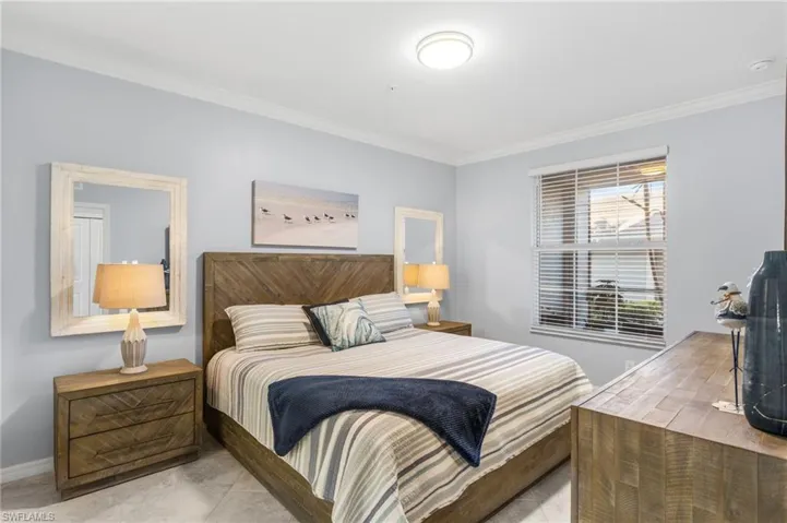Bedroom featuring crown molding