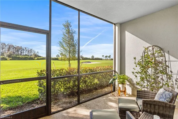 Sunroom / solarium featuring golf course view