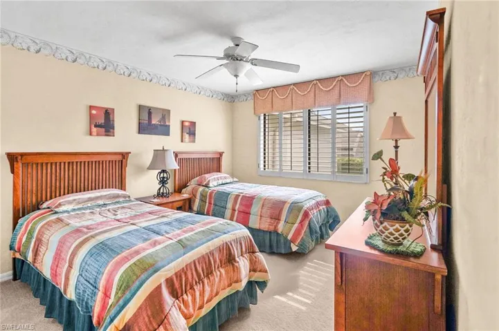 Bedroom with carpet and a ceiling fan