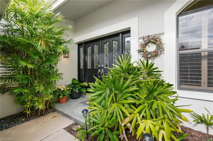 Property entrance featuring stucco siding