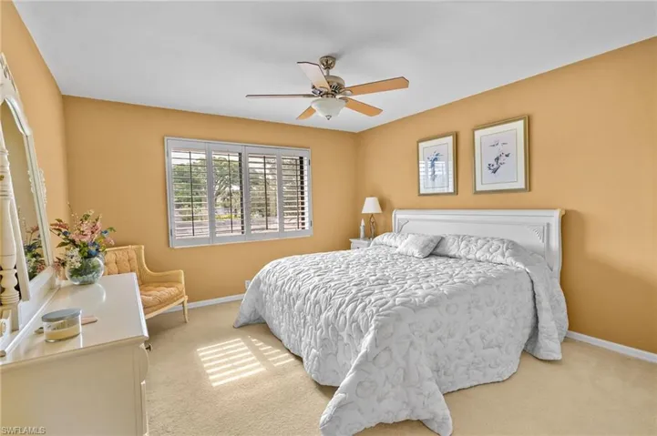 Bedroom with carpet and ceiling fan