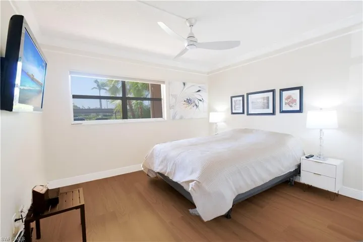 Bedroom with wood-type flooring and ceiling fan