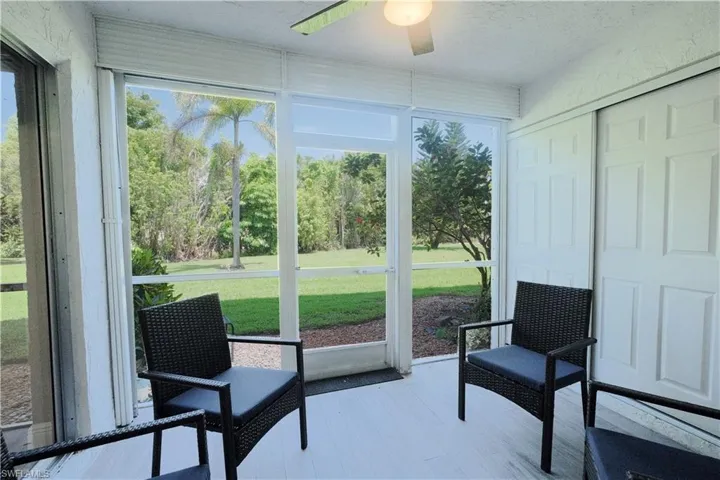 Sunroom / solarium with a healthy amount of sunlight and ceiling fan