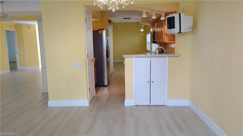 Dining Room - Kitchen - View of Living Room & Den
