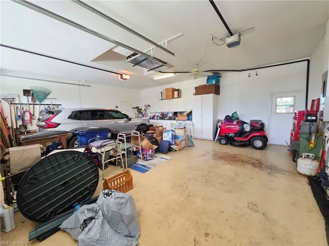 Garage featuring a garage door opener