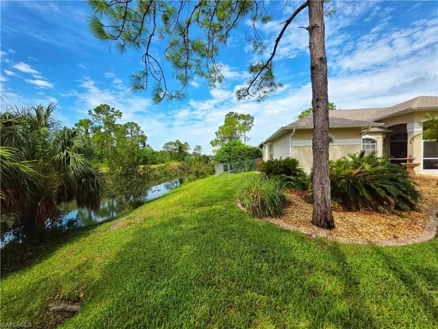 View of green lawn with a water view