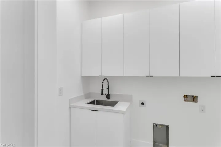 Laundry area featuring washer hookup, cabinet space, and hookup for an electric dryer