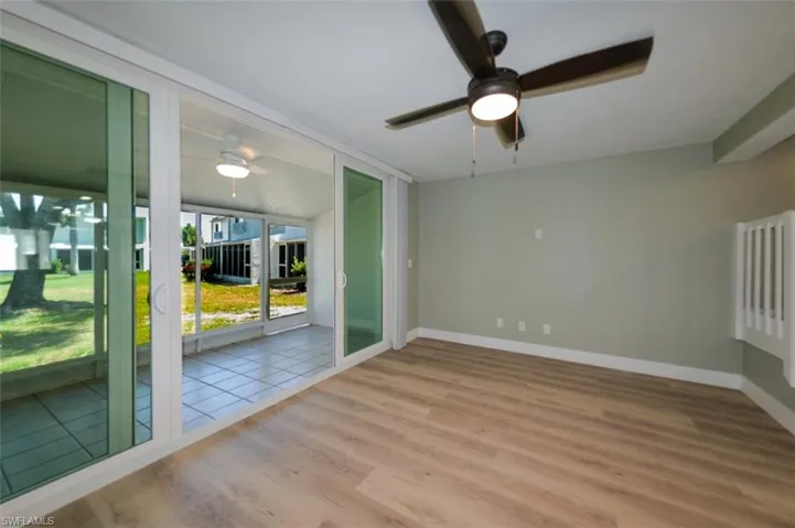 Tiled spare room with ceiling fan