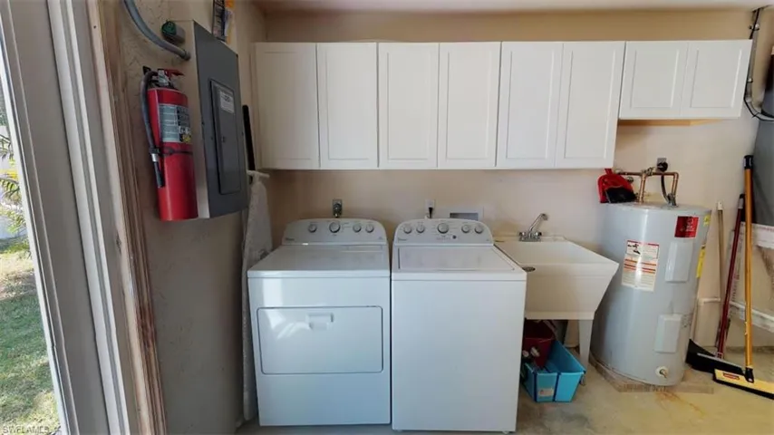 Washer, Dryer and Laundry Tub with Cabinets in Garage!