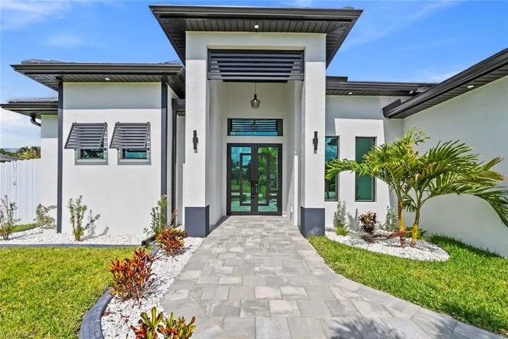 Entrance to property with french doors and stucco siding
