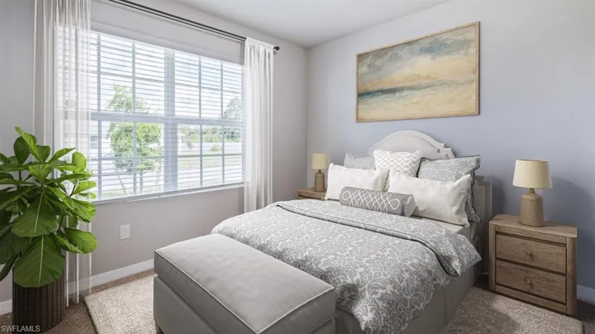 This image is virtually staged. Bedroom featuring carpet and baseboards