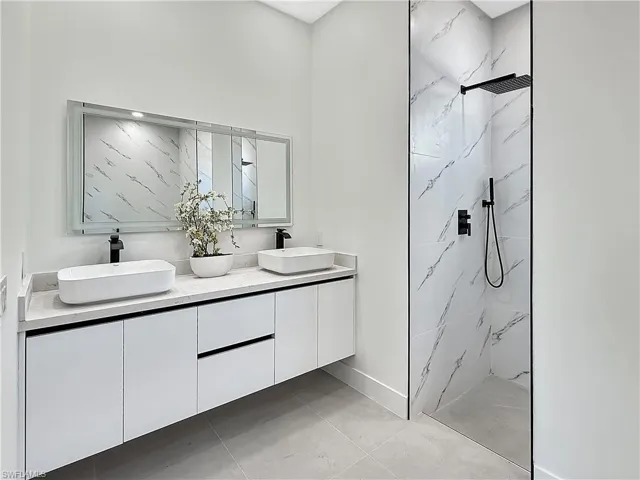 Dual vessel sinks with matte black faucets