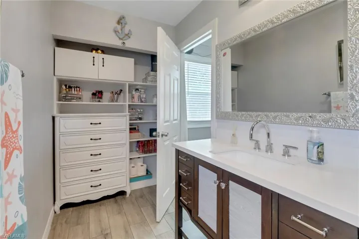 Bathroom with vanity and wood finished floors