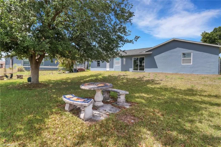 View of yard featuring fence