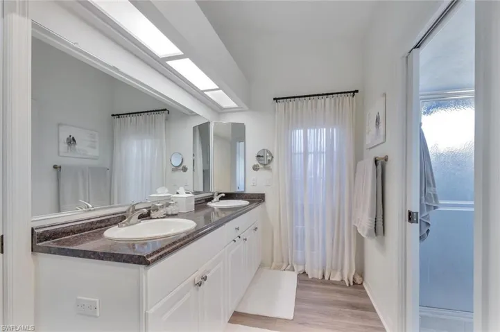 double vanities and a door you can create an outdoor shower
