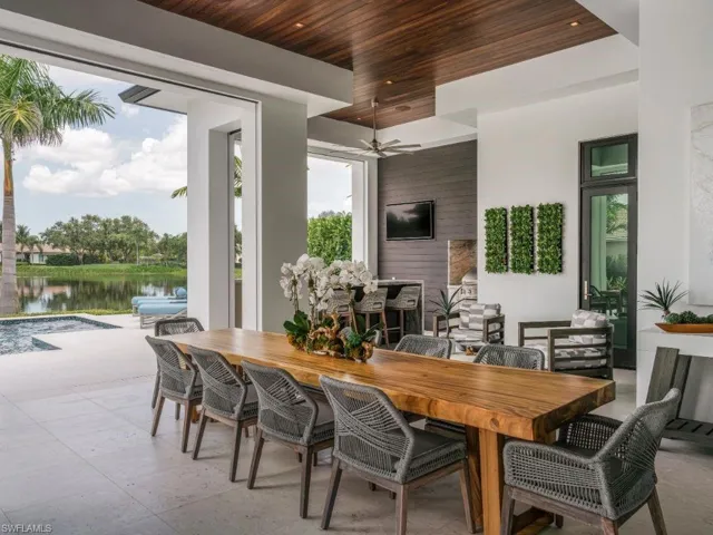Outdoor dining area with a grand live-edge table easily seating 10 guests