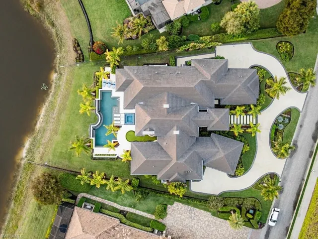 Aerial view of the house and proximity to oversized pond behind it.